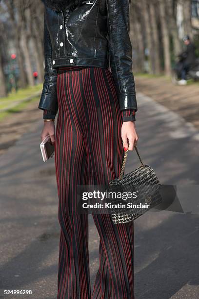 Fashion Blogger Lala Rudge wears Courreges jacket, Balmain trousers and Chanel bag on day 7 during Paris Fashion Week Autumn/Winter 2016/17 on March...