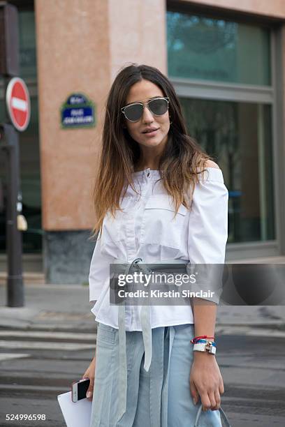 Fashion Blogger Tamara Kalinic wears a Suno skirt, Dior sunglasses, Stuart Weitzman boots, Fendi bag on day 7 during Paris Fashion Week Autumn/Winter...