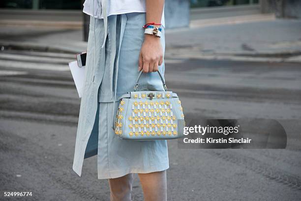 Fashion Blogger Tamara Kalinic wears a Suno skirt, Dior sunglasses, Stuart Weitzman boots, Fendi bag on day 7 during Paris Fashion Week Autumn/Winter...