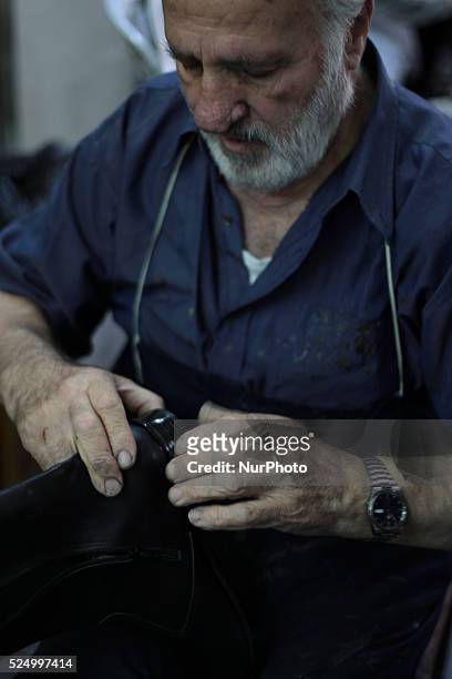 Shoemaker works in a shoe-making workshop manually. Old town of Nablus city, West Bank on May 31, 2015. Nablus city, northern of the Palestinian...