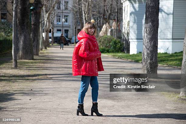 Fashion Stylist and creative consultant at Allure Russia Anya Ziourova wears a red AWAKE jacket and denim jeans on day 7 during Paris Fashion Week...