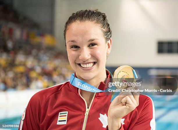 Chantal Van Landeghem, of Canada with her gold medal after the medal ceremony for the womens' 100 meter freestyle during the swimming competition at...