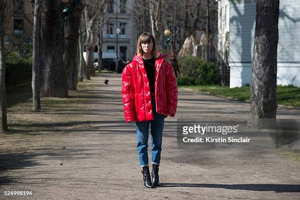 Fashion Stylist and creative consultant at Allure Russia Anya Ziourova wears a red AWAKE jacket and denim jeans on day 7 during Paris Fashion Week...