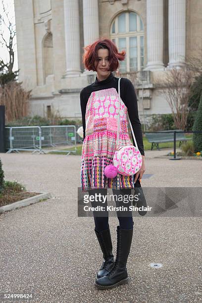 Model Shaked Aiach wears a Liron Itzhakov dress anf bag, Dr Martens boots on day 7 during Paris Fashion Week Autumn/Winter 2016/17 on March 7, 2016...