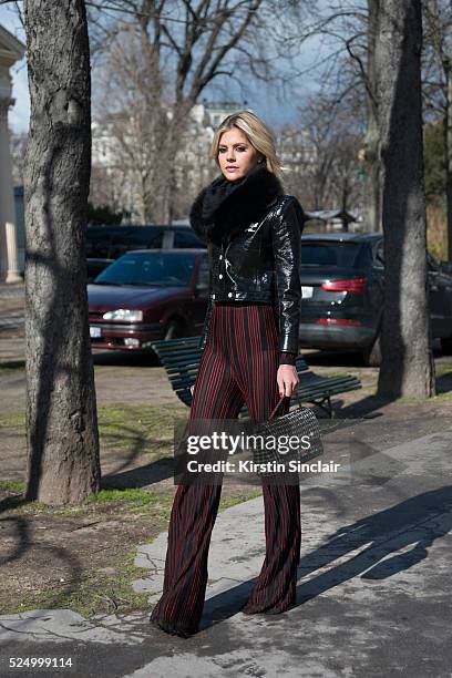 Fashion Blogger Lala Rudge wears Courreges jacket, Balmain trousers and Chanel bag on day 7 during Paris Fashion Week Autumn/Winter 2016/17 on March...