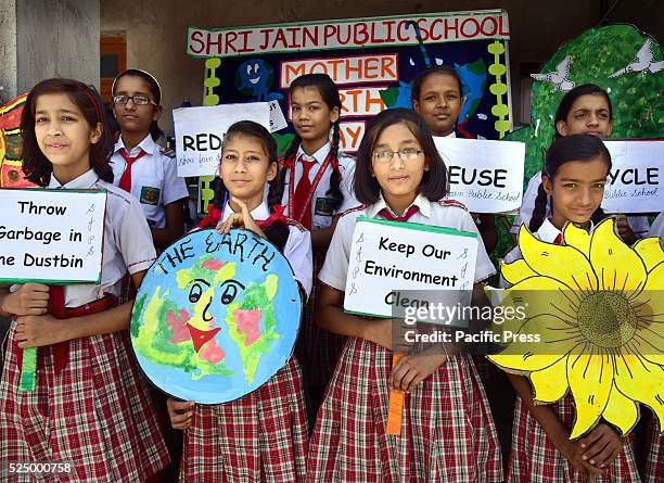 School children spreading social messages through paintings for saving the environment on the eve of "World Earth Day" in Bikaner.