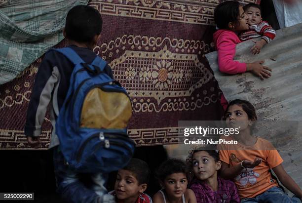 Szf8dce7 Caption Palestinian children play next to their home destroyed during the 50-day conflict between Hamas militants and Israel, in Shejaiya...