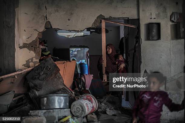 Palestinian woman stands in his home destroyed during the 50-day conflict between Hamas militants and Israel, in Shejaiya neighbourhood in the east...