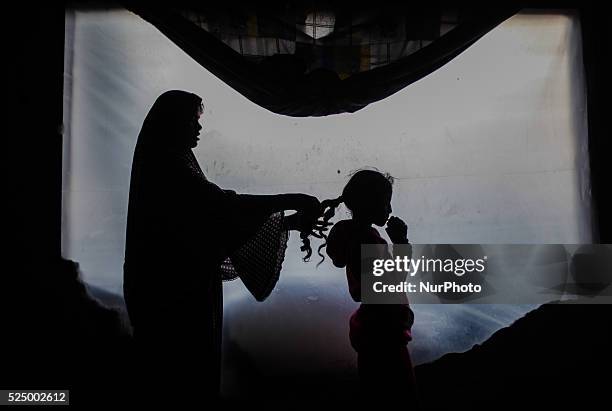 Palestinian woman stands inside her home destroyed during the 50-day conflict between Hamas militants and Israel, in Shejaiya neighbourhood in the...