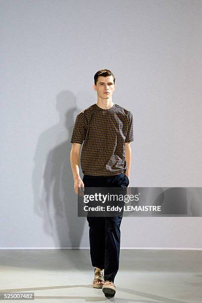 Model presents a creation from the Spring/Summer 2012/2013 Men's collection of Wooyoungmi at the Paris Fashion Week, in Paris, France, 30 June 2012....