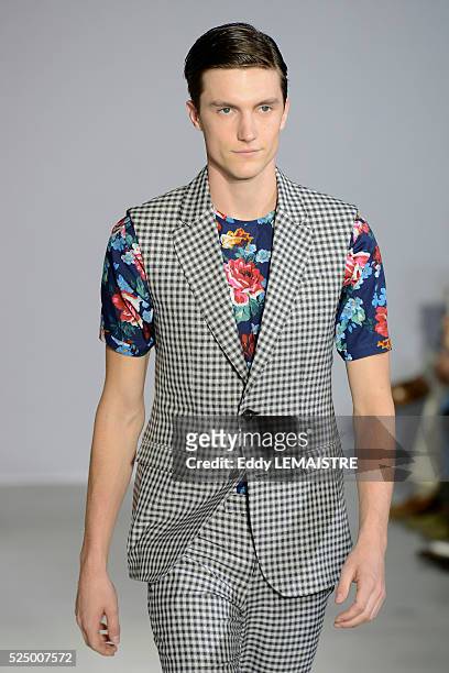 Model presents a creation from the Spring/Summer 2012/2013 Men's collection of Wooyoungmi at the Paris Fashion Week, in Paris, France, 30 June 2012....