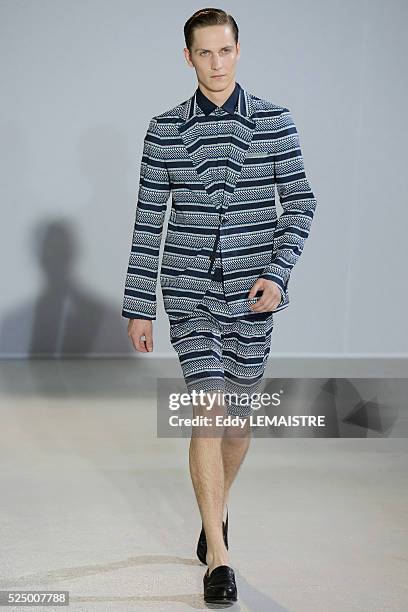 Model presents a creation from the Spring/Summer 2012/2013 Men's collection of Wooyoungmi at the Paris Fashion Week, in Paris, France, 30 June 2012....