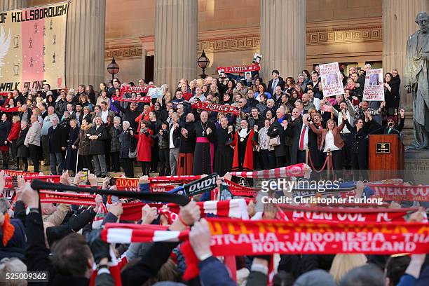 Margaret Aspinall and the Mayor of Liverpool Joe Anderson sing "you'll never walk alone" along with thousands of people outside Liverpool's Saint...