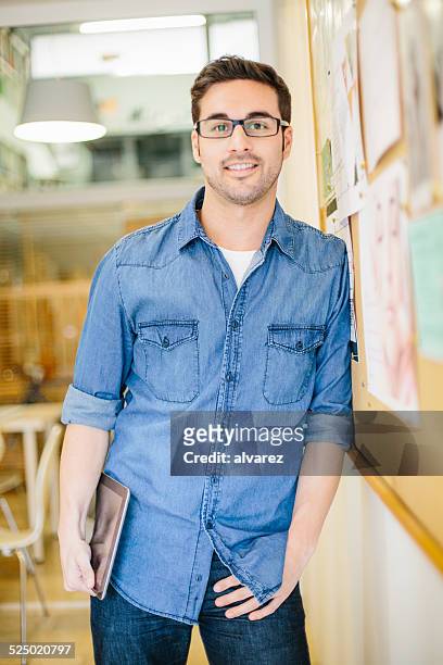 portrait of young businessman at start up - startup founder stock pictures, royalty-free photos & images
