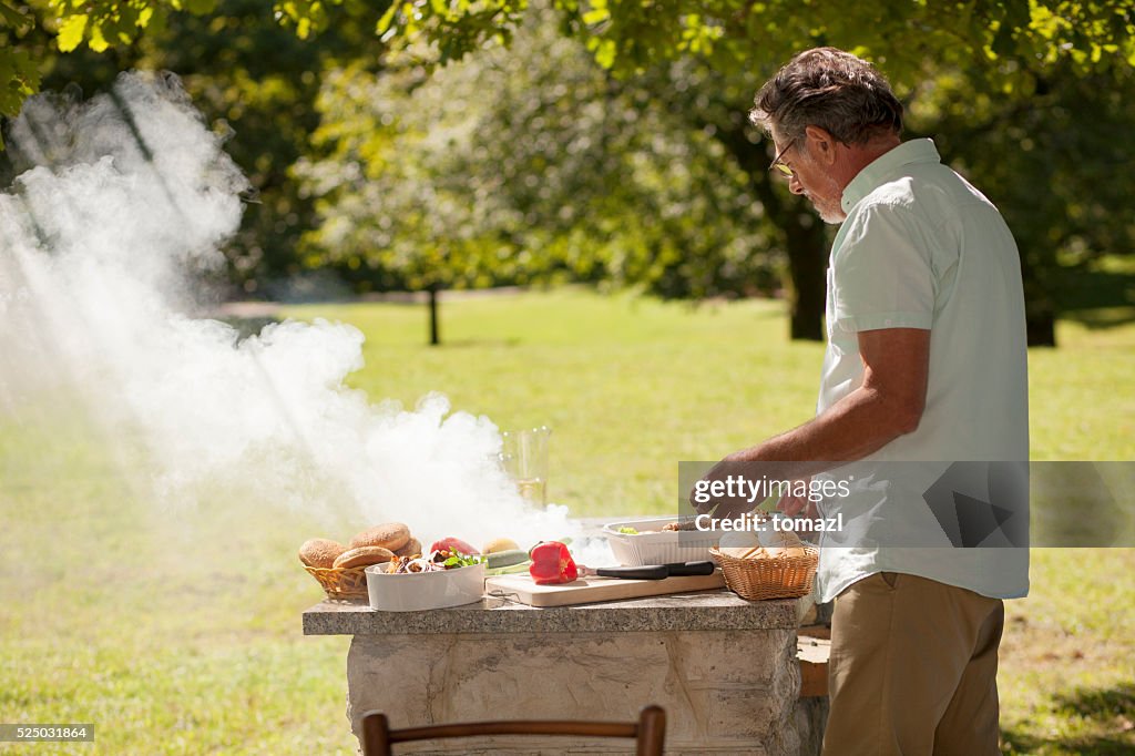 Grandfather at barbecue