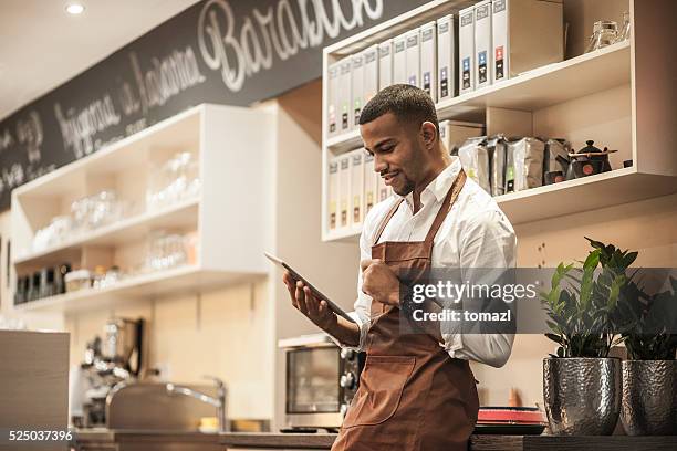 young afro-american bar owner ordering stock - tablet alcohol stock pictures, royalty-free photos & images