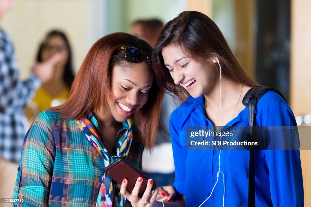 Compare Student High School Or College Students Comparing Notes After Class High-Res ...