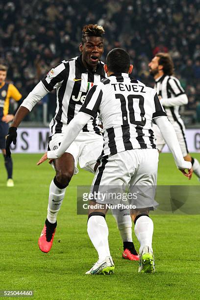 Juventus forward Carlos Tevez celebrates with Juventus midfielder Paul Pogba after scoring his goal during the Serie A football match n.19 JUVENTUS -...