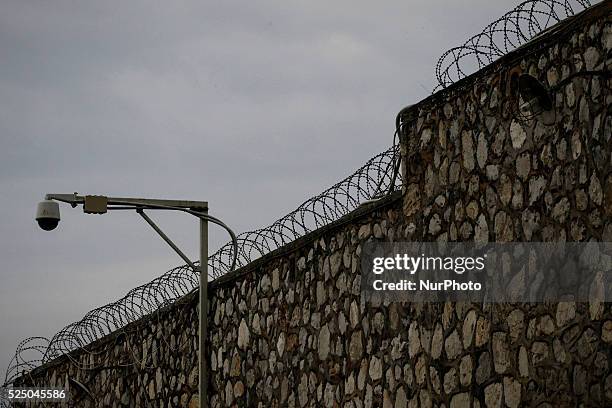 View of the Korydallos Prison. Barbed wire and surveillance camera. Athens, April 20, 2015.