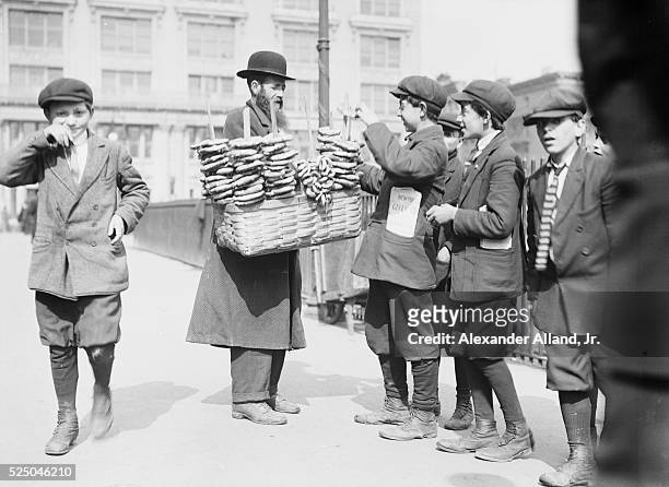 Pretzel vendor and boys. Lower East Side, New York City.