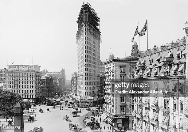 Flatiron Building under construction at East 23 Street where Broadway crosses Fifth Avenue.