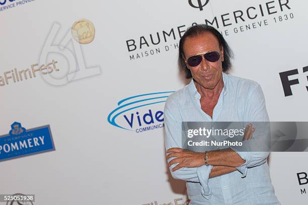 Italian singer-songwriter Antonello Venditti poses for photographers during the 61th Taormina Film Festival, in Taormina, Sicily Island, Italy, 17...