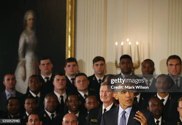 President Barack Obama speaks during the Commander-in-Chief trophy presentation to the United States Naval Academy football team in the East Room of...