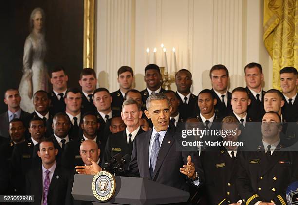 President Barack Obama speaks during the Commander-in-Chief trophy presentation to the United States Naval Academy football team in the East Room of...
