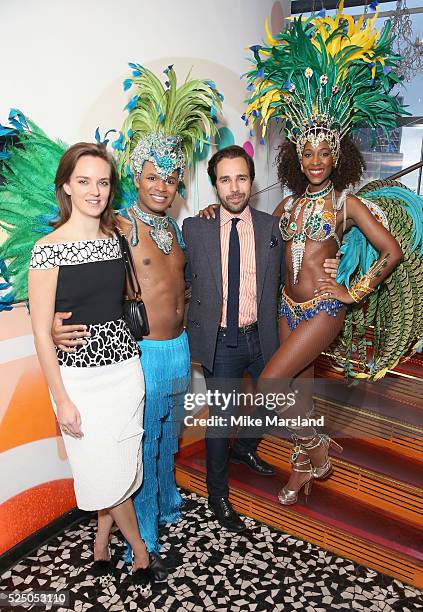 Charlotte Carroll and Diego Bivero-Volpe pose with Brazilian dancers at a VIP Dinner to highlight OMEGAs association with the Olympic movement and...