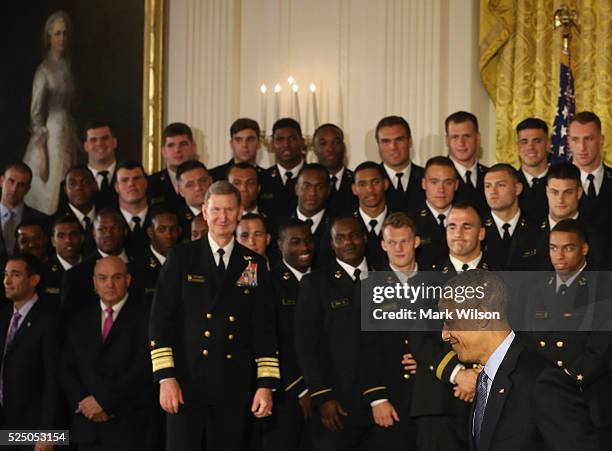 President Barack Obama walks away after the Commander-in-Chief trophy presentation to the United States Naval Academy football team in the East Room...