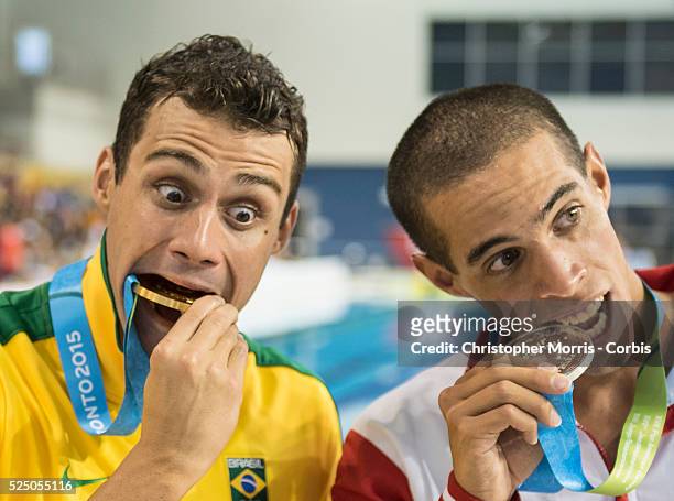 Zach Chetrat, of Canada , Leonardo De Deus, of Brazil and Mauricio Fiol, of Peru after the medal ceremony for the men's 200 meter butterfly during...