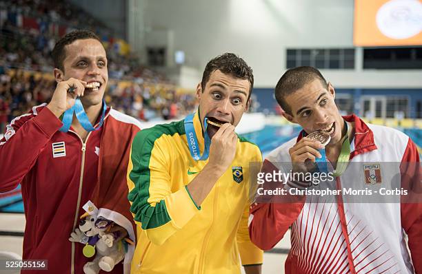Zach Chetrat, of Canada , Leonardo De Deus, of Brazil and Mauricio Fiol, of Peru after the medal ceremony for the men's 200 meter butterfly during...