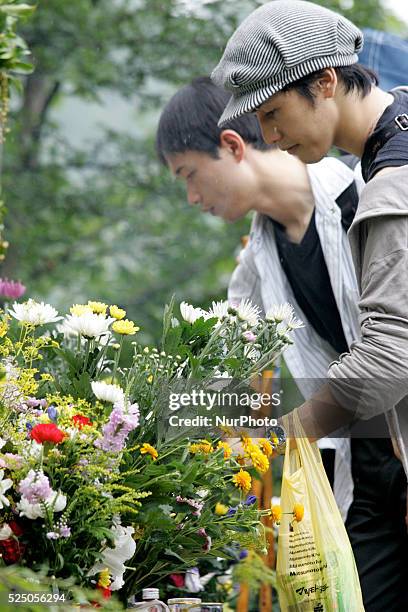 Relatives of the victims of the 1985 Japan Airlines jumbo jet crash pray in front of the victims' monument at Osutaka Ridge north of Tokyo, Japan,...