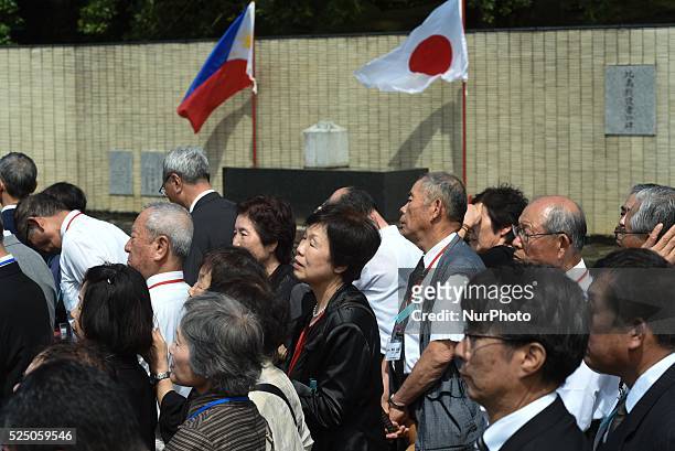 Philippines - Relatives of the fallen Japanese soldiers of WW2 watch as Japanese Emperor Akihito and his wife Empress Michiko greet other attendees...