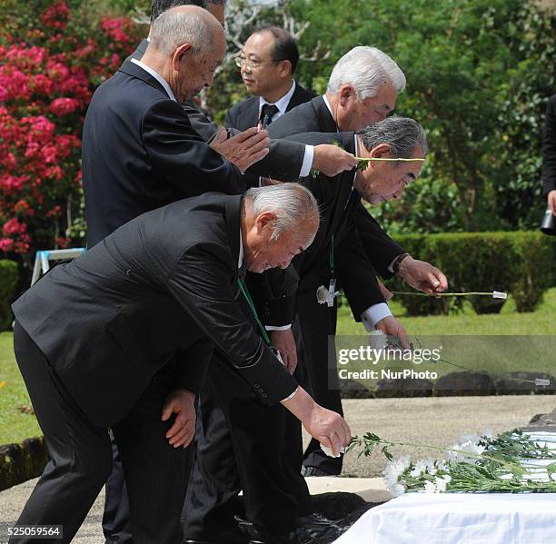 Philippines - Relatives of the fallen Japanese soldiers of WW2 offer flowers and prayers to their dead during a ceremony at a Japanese war memorial...