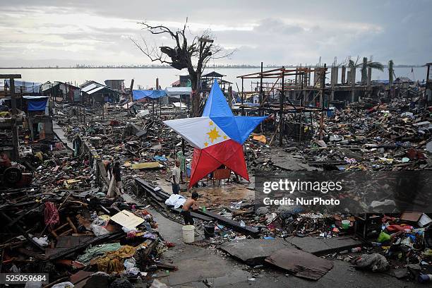 Giant Christmas lantern with the colors of the Philippine flag is seen in a devastated area in Tacloban, Philippines, December 24, 2013. More than a...