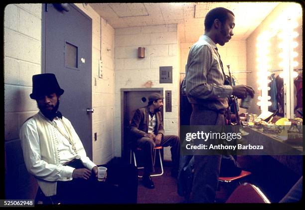 American Jazz musician Henry Threadgill , trumpet player Olu Dara , and unidentified others relax backstage at the Sweet Basil nightclub, New York,...