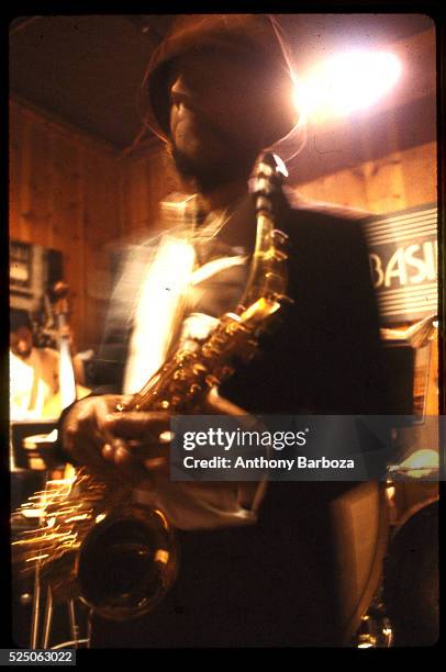 American Jazz musician Henry Threadgill plays saxophone as he performs onstage at the Sweet Basil nightclub, New York, New York, 1983.