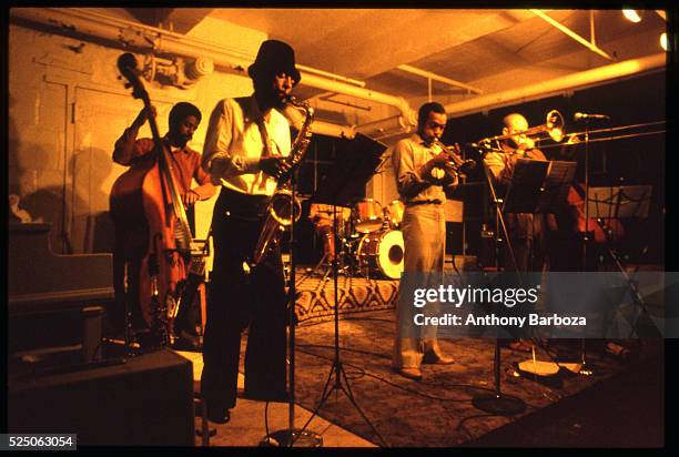 American Jazz musician Henry Threadgill plays saxophone as he performs onstage, with his sextet, in a loft at 450 West 31st Street, New York, New...