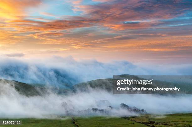 misty covered hills with a golden sky. peakshill & snels low from rushup edge. peak district national park. uk. europe. - edale stock pictures, royalty-free photos & images