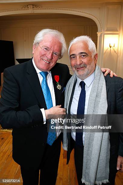 Alain Duault and CookChief Guy Savoy attend as Alain Duault is honored with the Insignia of Officer of the Legion of Honor at Salle Gaveau on April...