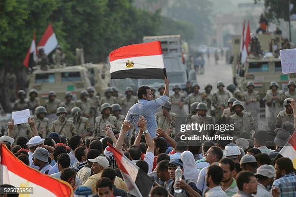 Supporters of the ousted President Mohammed Morsi gather in front of army check point in Cairo, Egypt, Monday, July 8, 2013. Photo: Nameer...