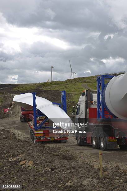 Lorries delivering turbine blades to a wind farm construction site near the towns of Bacup and Todmoreden in the Calderdale area of West Yorkshire,...