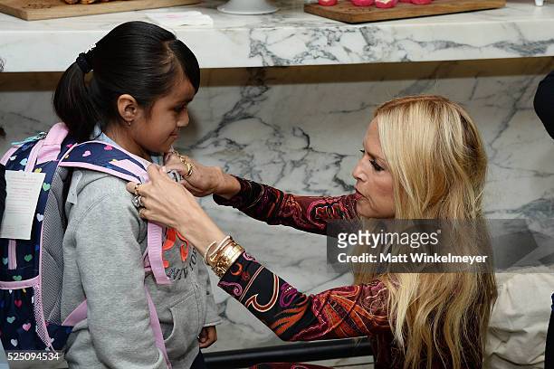 Designer Rachel Zoe interacts with guests during the Baby2Baby Mother's Day Party presented by Tiny Prints at AU FUDGE on April 27, 2016 in West...