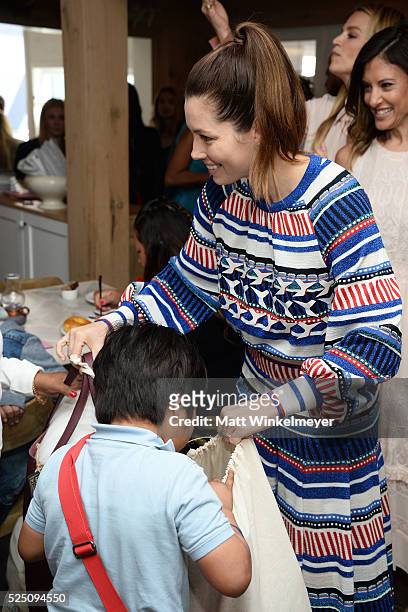 Actress Jessica Biel interacts with guests during the Baby2Baby Mother's Day Party presented by Tiny Prints at AU FUDGE on April 27, 2016 in West...