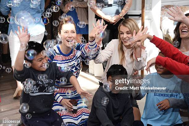 Actress Jessica Biel and model/co-president of Baby2Baby Kelly Sawyer Patricof interact with guests during the Baby2Baby Mother's Day Party presented...