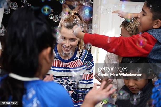 Actress Jessica Biel and model/co-president of Baby2Baby Kelly Sawyer Patricof interact with guests during the Baby2Baby Mother's Day Party presented...