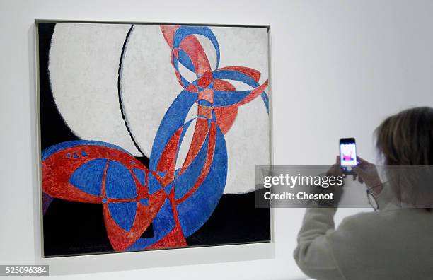 Visitor takes a picture of a painting Amorpha, fugue in two colors of Frantisek Kupka as part of the opening of the exhibition "Keys to a Passion" at...