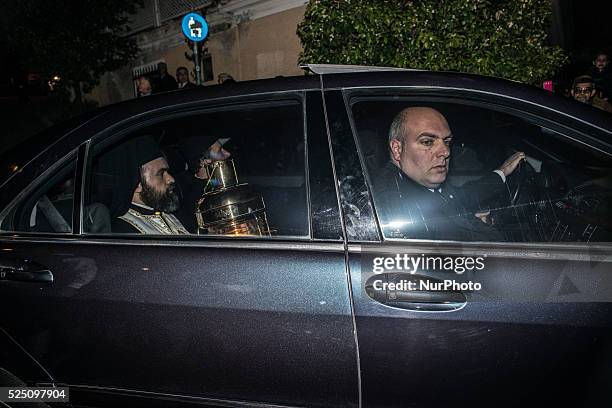 Orthodox Priests bring the Holy Ressurection Light from the Holy Sepulcher of Jerusalem to the Metochion of the Holy Sepulcher in Athens Plaka on...