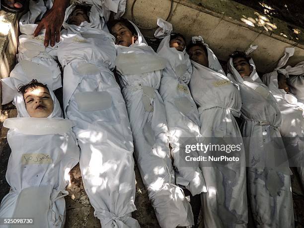 Corpses of children killed by nerve gas after a suspected chemical weapons attack on the Damascus suburb of Ghouta, in August 21, 2013. Photo: Erbin...